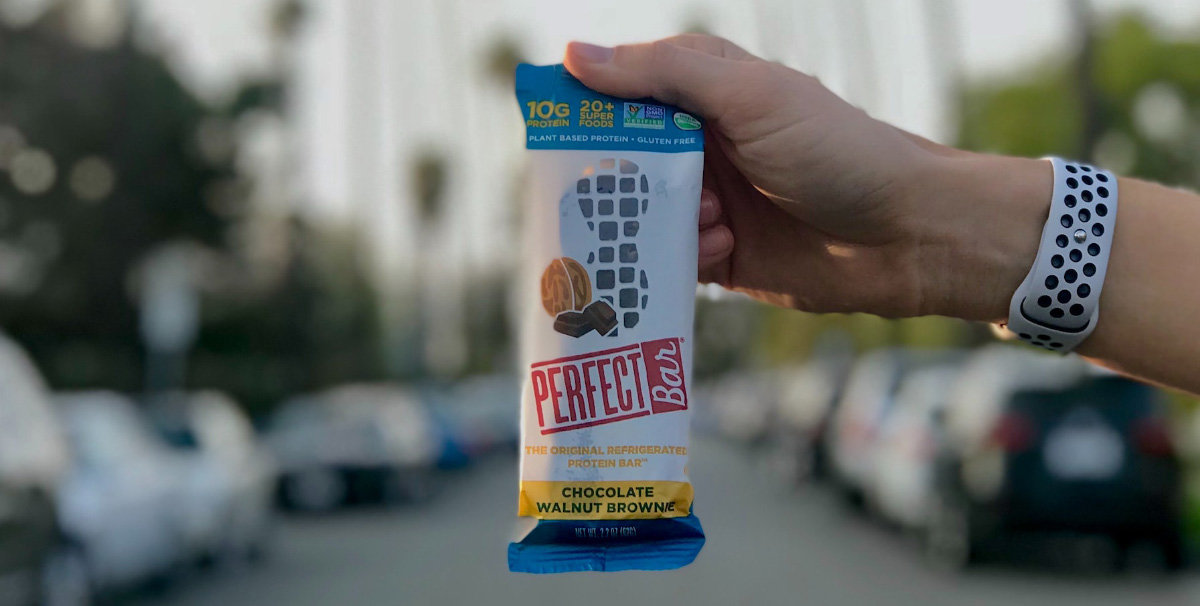 hand holding up protein bar