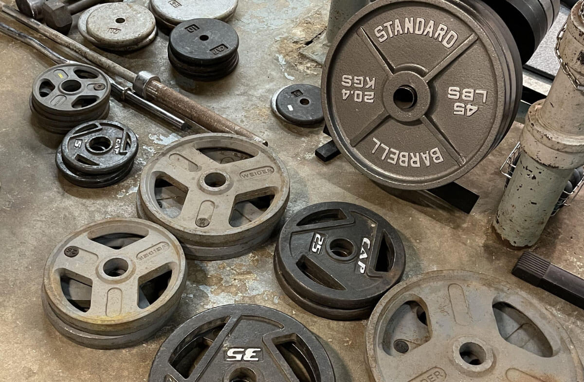 group of weight equipment on the floor